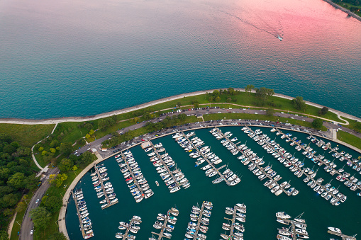 Splash of pink as sunsets over Chicago's Montrose Harbor