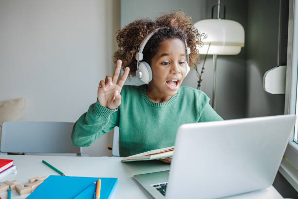 istock Little girl communicates on a video call with teacher 1340262806