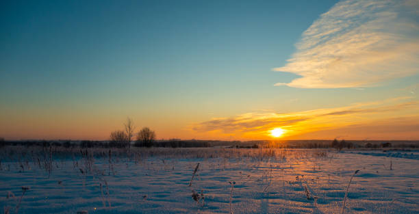 istock The beautiful sunset with tracks in snow winter background 1340263627