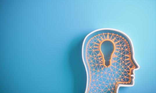 Lightbulb symbol with the wire connections in the cross section of human head on blue background, symbolizing big ideas, innovation concepts. (3d render)
