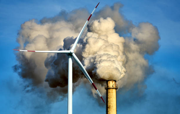 istock White steam cloud and smoke clouds rise from a high chimney into the blue sky 1340265594