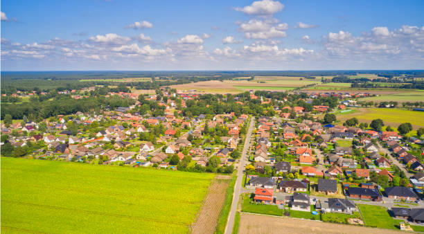 Aerial view of a village on the edge of the Luneburg Heath in northern Germany with single family houses on small plots of land Aerial view of a village on the edge of the Luneburg Heath in northern Germany with single family houses on small plots of land lüneburg heath stock pictures, royalty-free photos & images