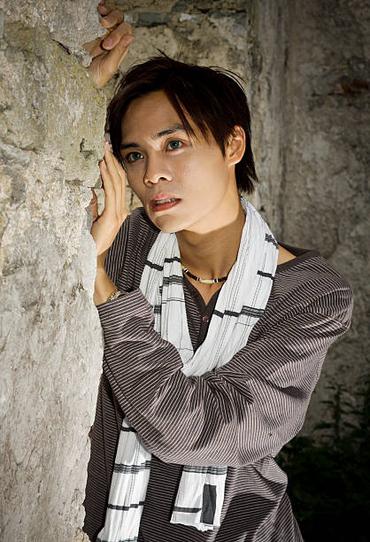 Young Man Posing Against Castle Walls stock photo