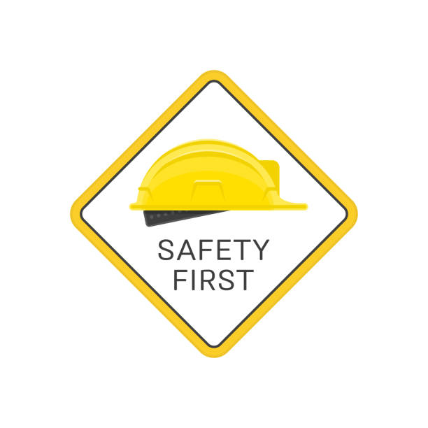 Safety first helmet vector. Warning sign with a yellow construction helmet and the inscription safety first. Builder hard hat sign isolated on white background. Concept safety in building work. Vector illustration EPS 10. emergency response stock illustrations