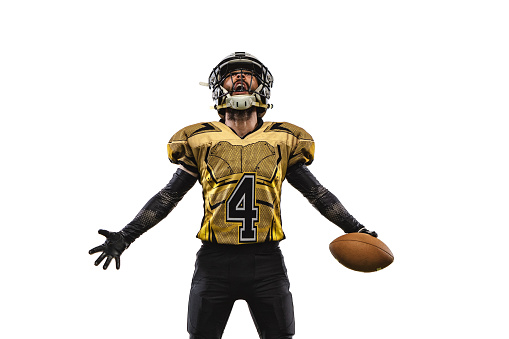 Winner. Portrait of professional american football player in unifor standing in winning pose isolated over white baclground. Concept of active life, team game, energy, sport, competition, ad