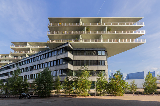 Basel, Switzerland - September 13. 2021: The modern architecture of building complex Transitlager for business and residential at Dreispitz district, Basel.