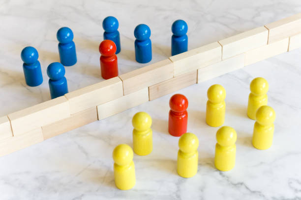istock Game character concepts - two groups separated by a wall - two overcome the separation 1340274642