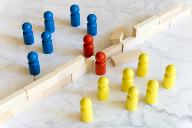 istock Game character concepts - two groups separated by a wall - two overcome the separation 1340274675