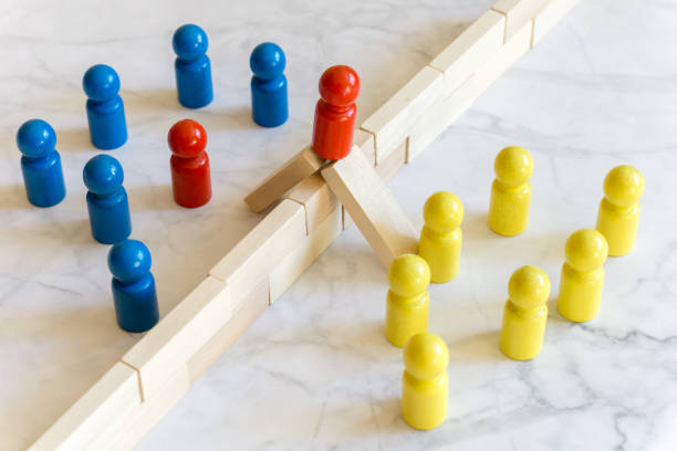 istock Game character concepts - two groups separated by a wall - two overcome the separation 1340274768