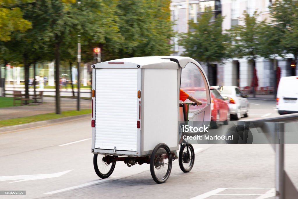 Sustainable delivery cargo bike Sustainable delivery cargo bike in a city Cargo Bike Stock Photo