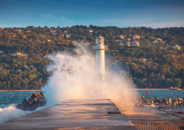 Lighthouse and splashing wave in Varna, Bulgaria