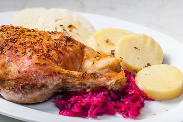 istock roasted goose leg with red cabbage and dumplings 1340279646