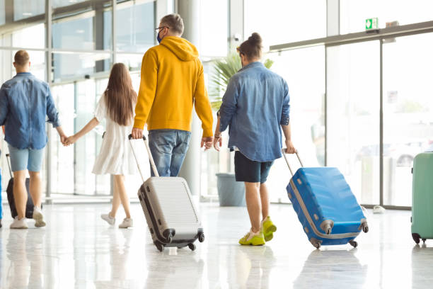 istock Passengers at the airport with luggage 1340279713
