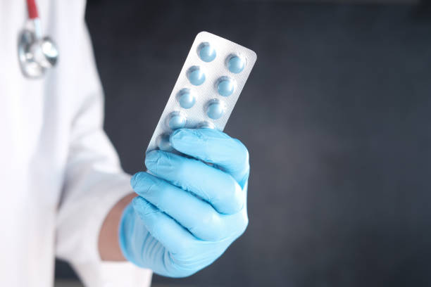 istock doctor hand holding blister pack with copy space 1340280874