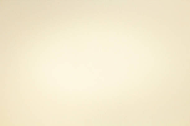 istock Yellow pastel paper sheet texture with light vignette,  copy space. 1340282200