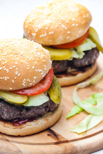 istock homemade hamburger with pickled cucumber and tomato 1340282824