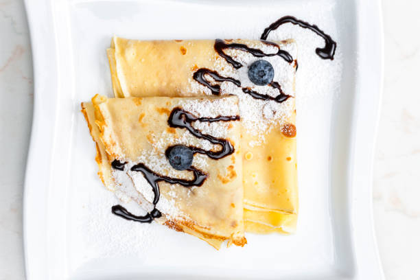 istock pancakes with blueberries and chocolate sauce 1340284169