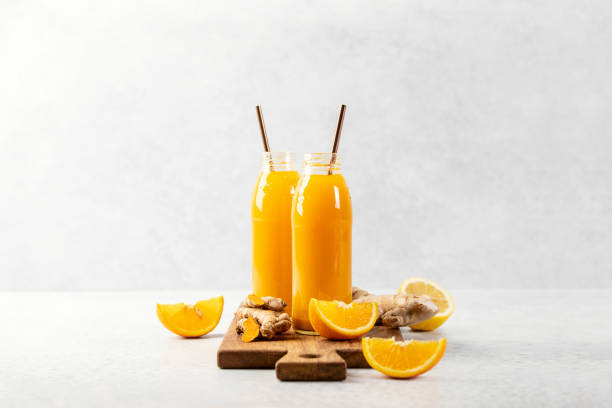 Ginger turmeric shots ready to drink stock photo