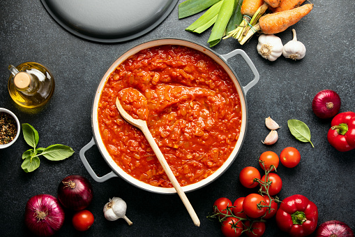 Homemade tomato sauce recipe culinary concept, top down view