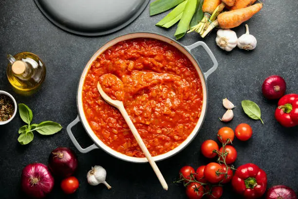 Homemade tomato sauce recipe culinary concept, top down view