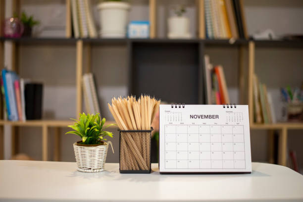 istock 2021 Calendar desk place on table. Desktop Calender for Planner to plan agenda, timetable, appointment, organization, management each date, month, and year on wooden office table.Calendar Concept. 1340288675