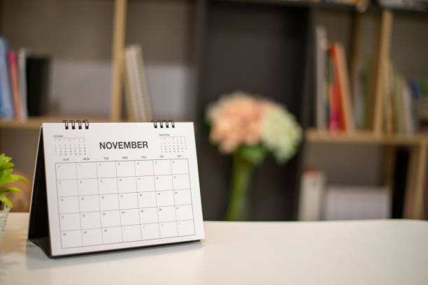 2021 Calendar desk place on table. Desktop Calender for Planner to plan agenda, timetable, appointment, organization, management each date, month, and year on wooden office table.Calendar Concept.