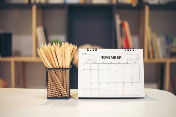 istock 2021 Calendar desk place on table. Desktop Calender for Planner to plan agenda, timetable, appointment, organization, management each date, month, and year on wooden office table.Calendar Concept. 1340288680