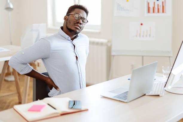 istock Sitting too long can cause back pain 1340290753