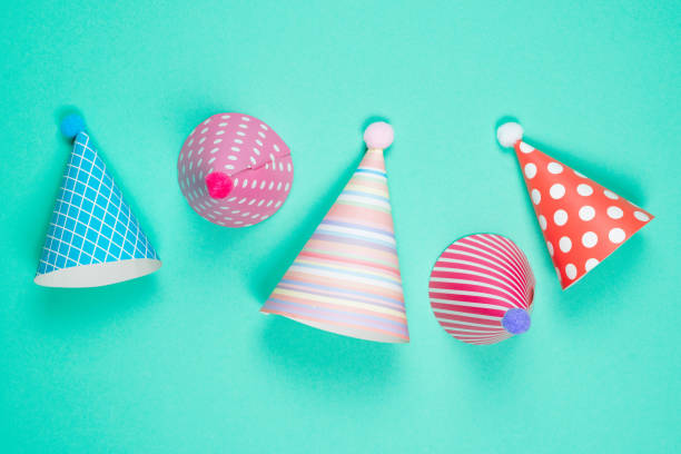 istock Colorful birthday caps on a blue background. Top view. 1340292870