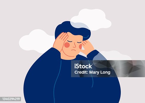 istock A sad young man has a clouded mind on blue background. A depressed teenager boy suffers from temporary memory loss and confusion. 1340294219