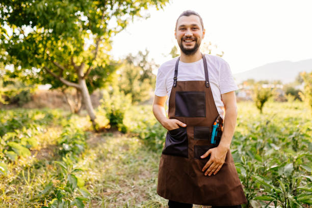 istock Smiling Young Farmer in Field 1340294308