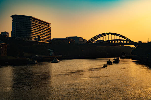 Wearmouth Bridge, Sunderland, England Wearmouth Bridge across the River Wear at sunset in summer, Sunderland, United Kingdom. Leica M10R 50mm Apo Summicron. river wear stock pictures, royalty-free photos & images