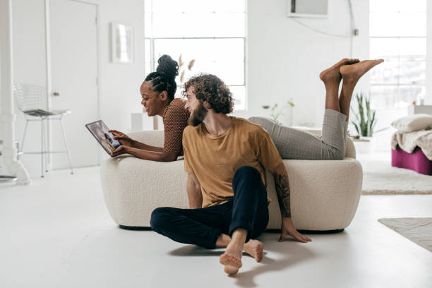 istock Young couple at home using online banking 1340295609