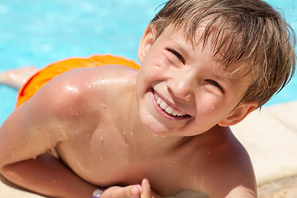 istock Happy boy in swimming pool 134029581
