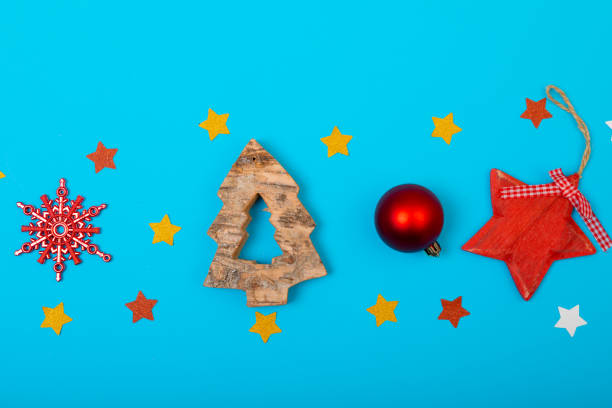 istock Composition of multiple christmas decorations with baubles and stars on blue background 1340295868