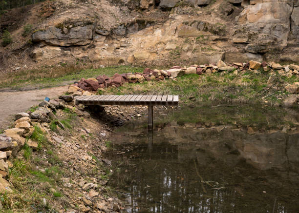 istock small lake inside of a forest 1340296779
