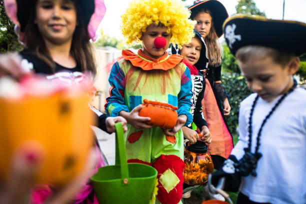 istock Cute kids trick-or-treating 1340298042