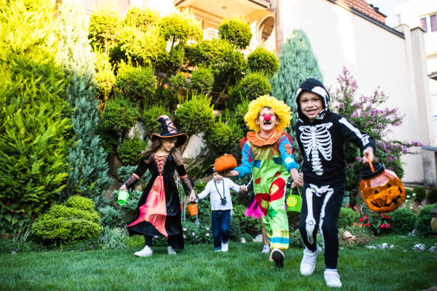 istock Little children running while trick-or-treating 1340298077