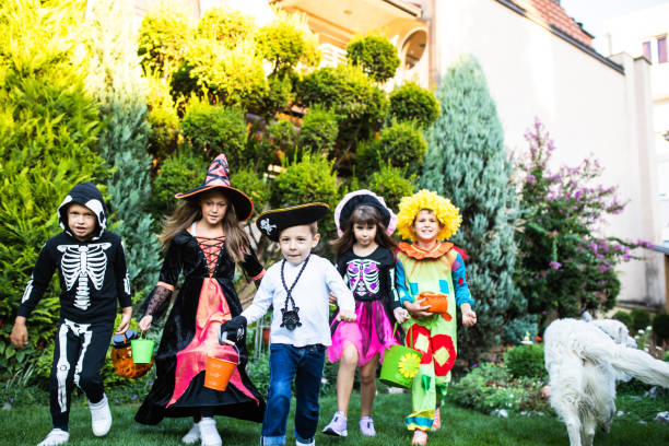 istock Cute children trick-or-treating 1340298082