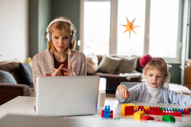 istock Woman working from home while her daughter is playing 1340302901