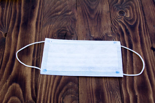 istock Protective medical mask on a dark background 1340303391