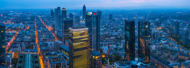 istock Frankfurt aerial panorama over skyscraper cityscape illuminated at dusk Germany 1340304089