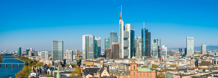 Aerial panoramic view across Frankfurt’s dynamic skyline, from the bridges across the River Main, the historic landmarks of the Old Town to the futuristic spires of the banking skyscrapers and the shops of Zeil and Hauptwache, Hesse, Germany.