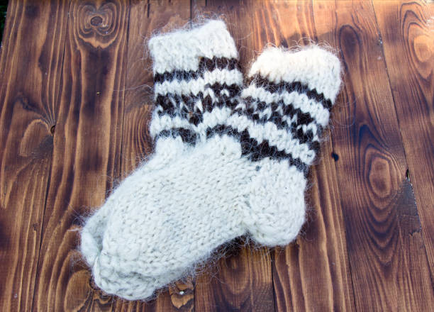 istock Knitted socks with natural wool on a dark background 1340304189