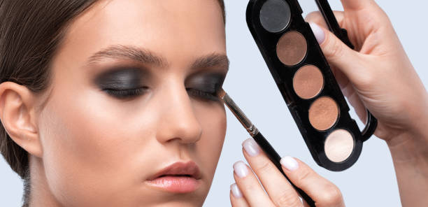 istock Beautiful woman with long eyelashes, beautiful make-up and thick eyebrows. Professional makeup and cosmetology skin care. 1340304583