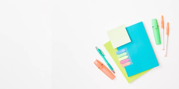 istock Flat lay frame with school and office supplies on a white background 1340305254