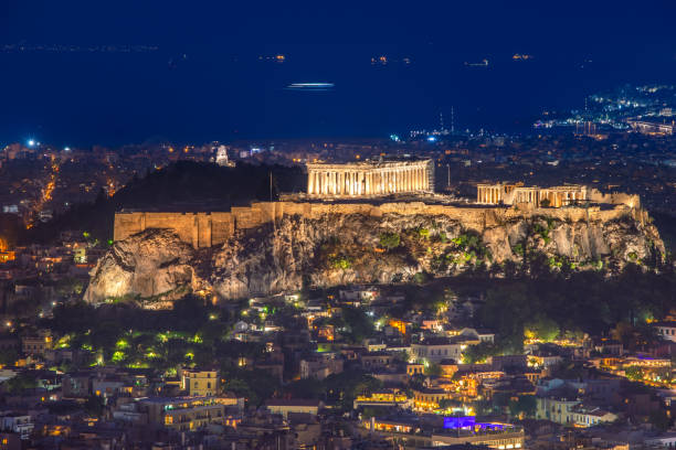 istock Illuminated Acropolis with Parthenon at night, Athens, Greece. 1340305557