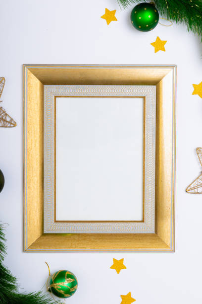 istock Composition of frame with copy space and fir tree branches with baubles on white background 1340306431