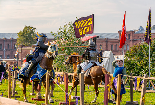 A demonstration of riding and drill of Polish uhlans from 1939, performed by a squadron of a historical reconstruction group. Two knights on horseback in armor