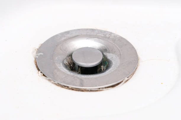 istock A sink drain hole with limescale or lime scale and rust on it, dirty rusty bathroom washbowl. 1340310130